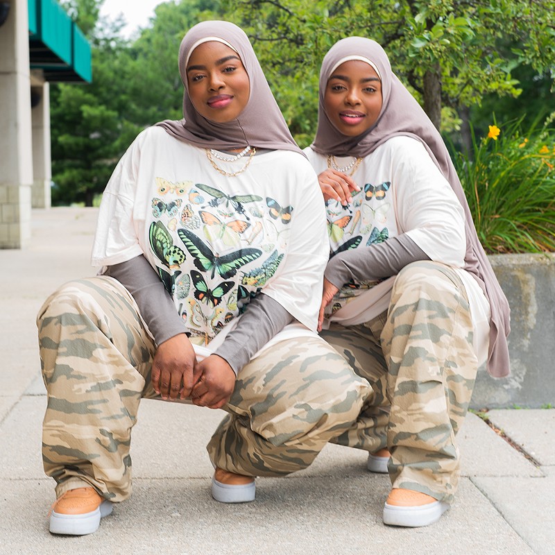 Born Zakiyyah Rahman (aka Yahzi, aka WiZdumb) and Sakinah Rahman (aka Inah, aka Straingth), the sisters of Aint Afraid moved to Michigan from Baltimore when they were toddlers. - Kahn Santori Davison