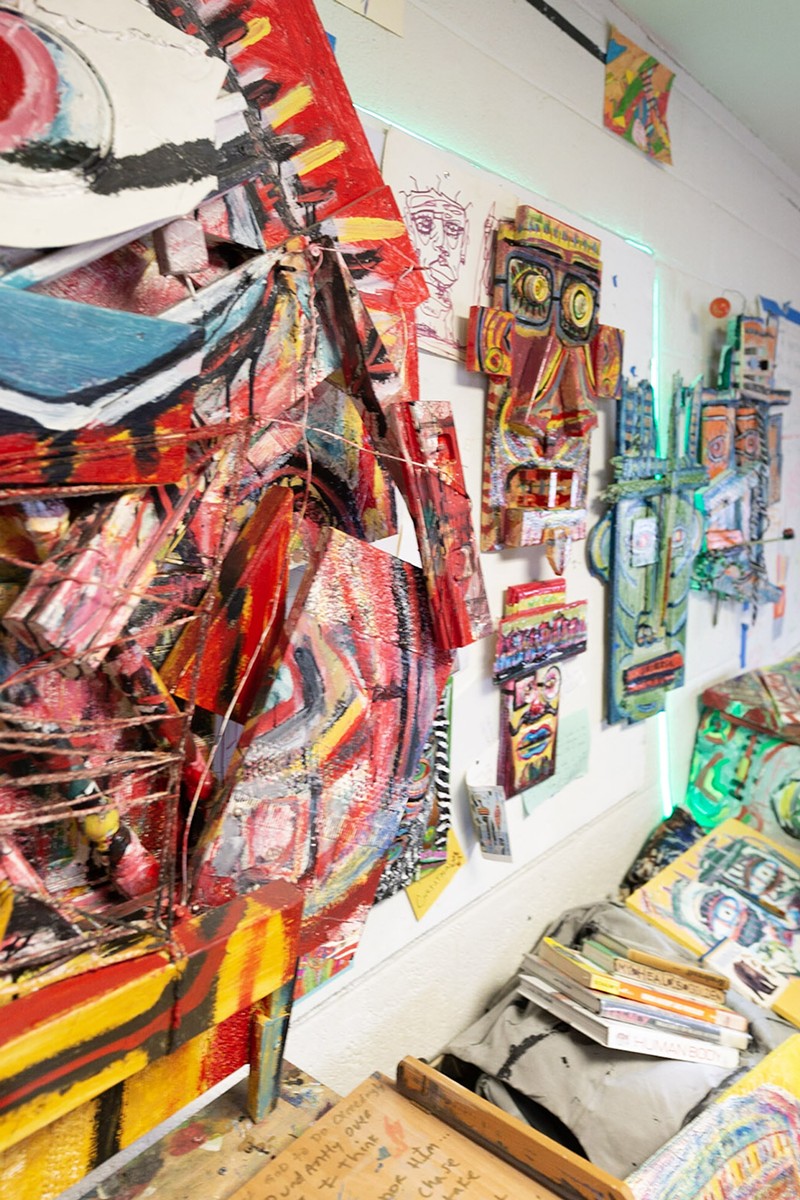 Work in Green’s studio. His piece “Mind Over Matter” (left) was made from broken banisters, wire, and paint cans. - Michael Christie Photography/Courtesy photo