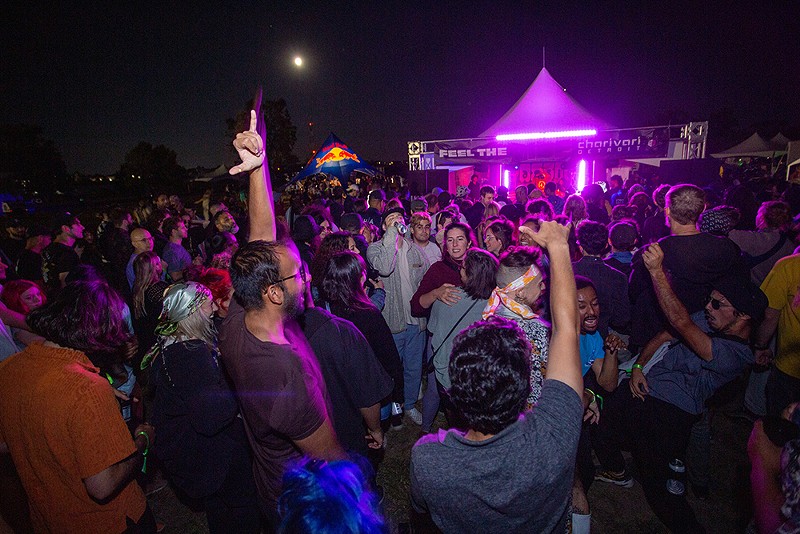 Revelers dance under the moon at Charivari Detroit Festival 2022. - Dontae Rockymore