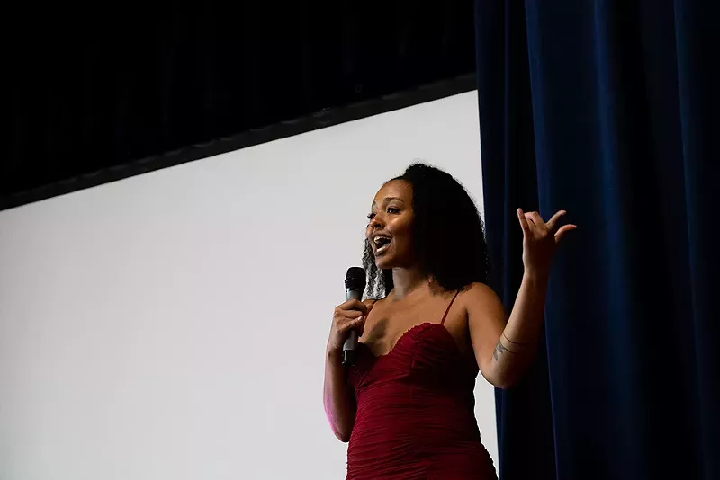 Chinelo Onuigbo, the youth program director of Congress of Communities, speaks. - Quinn Banks