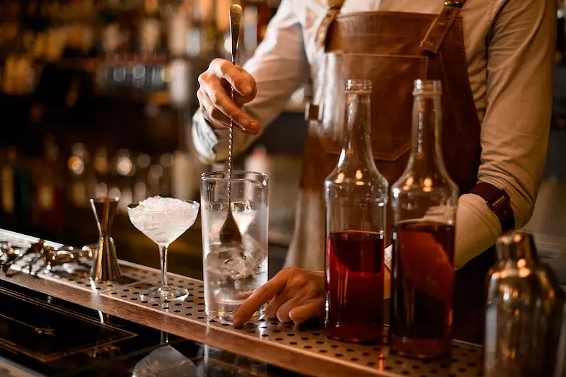 Do you want that cocktail here, or to go? - Shutterstock.com