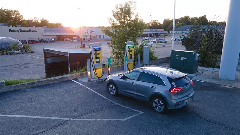 An electric car charging at a ChargePoint DC fast charger in Clare, Michigan. - Shutterstock