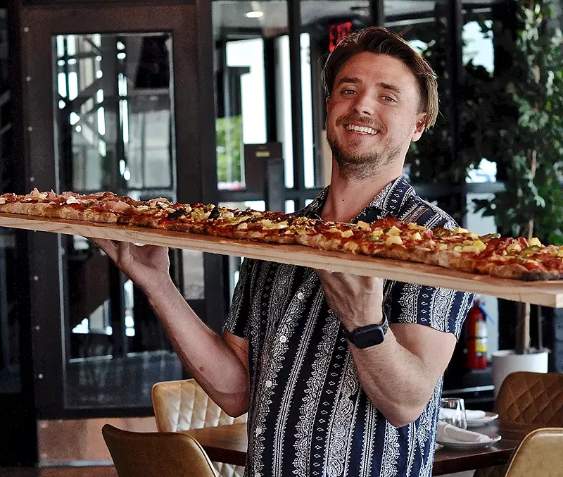 A unique menu item at Rochester Hills Social is the “pizza for the table,” allowing groups to enjoy an up to 8-foot pizza together. - Courtesy photo