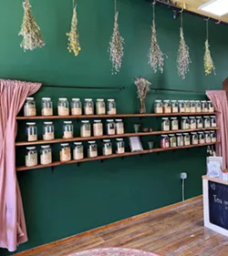 Jars of herbs fill the walls of this new Ypsi business. - Courtesy photo