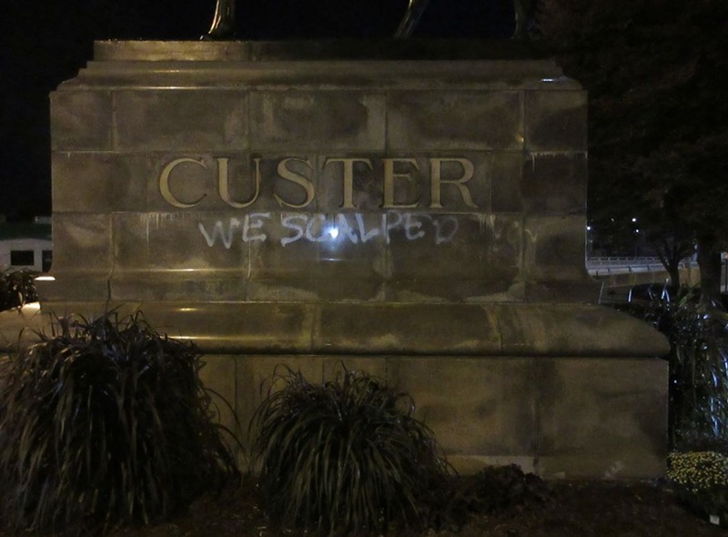 Activists spray-painted a monument to General George Armstrong Custer in Monroe in October 2022. - Monroe Police Department