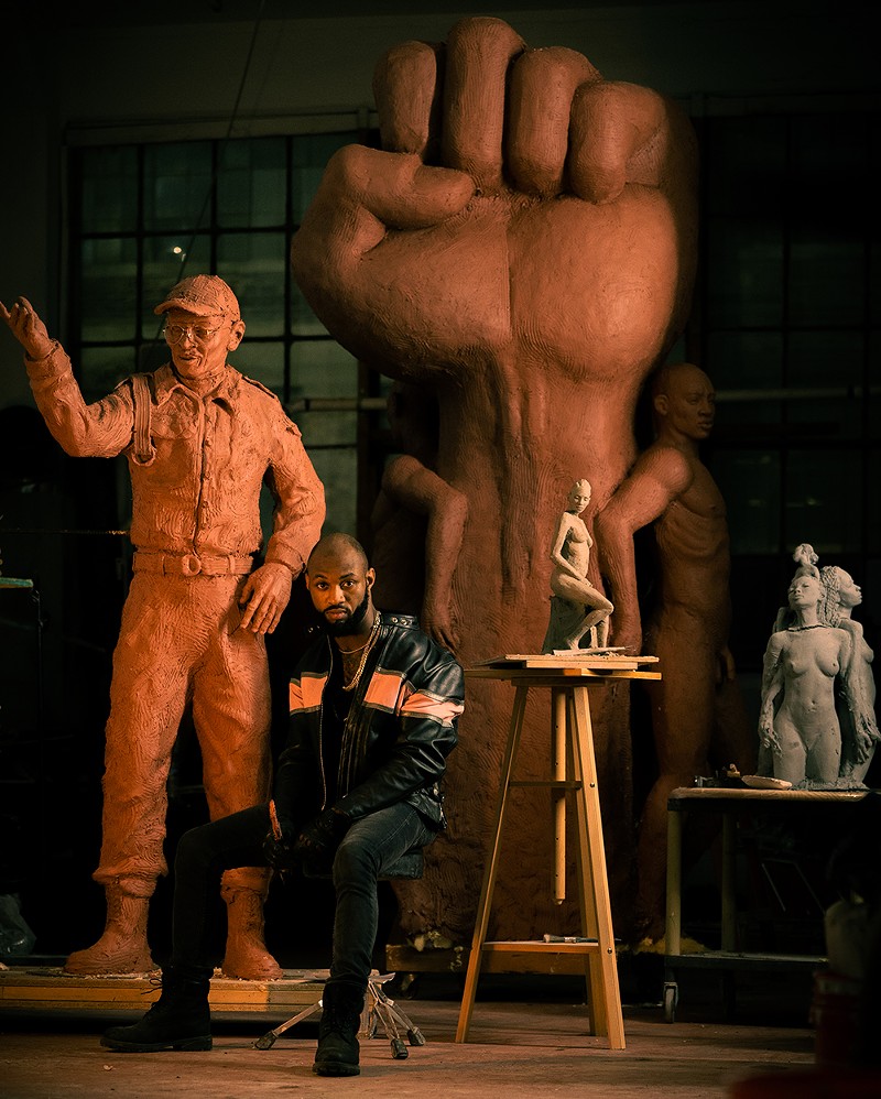 Sculptor Austen Brantley surrounded by his creations in his Detroit studio. - Hyder Alfalih