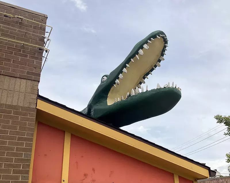 A huge plastic alligator dwells on the roof of Belleville’s Bayou Grill. - Jane Slaughter