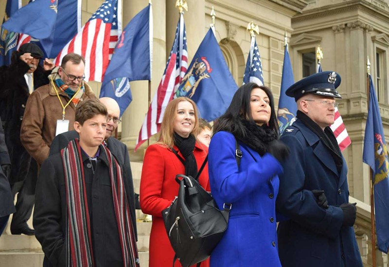 Col. Kevin Bohnsack, state air surgeon, Michigan Air National Guard, escorts Michigan Attorney General-elect Dana Nessel to the Capitol dais at the inauguration of Gov. Gretchen Whitmer, Lansing, Mich., Jan. 1, 2019. - Conner Flecks / Alamy Stock Photo