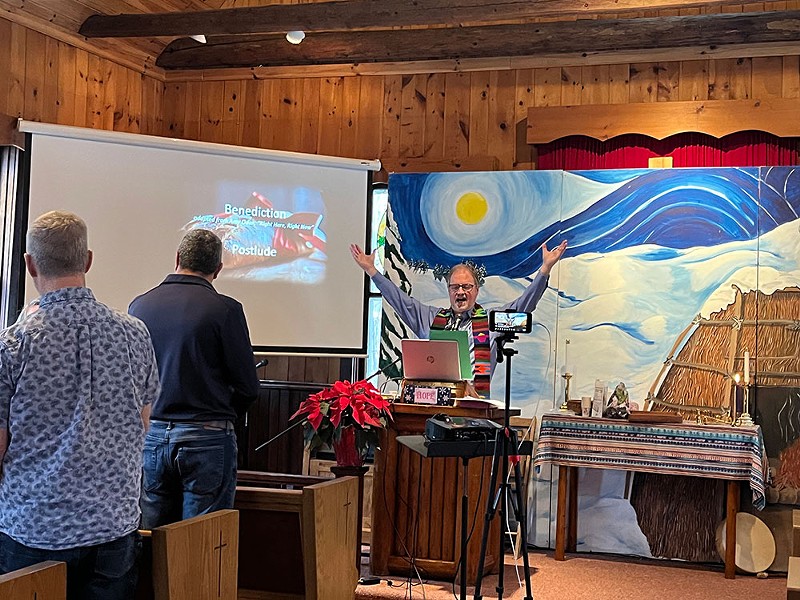Pastor John Mays talks to his congregation at Greensky Hill Indian United Methodist Church in Charlevoix, in December. The church is working on getting a solar array up and running. - Izzy Ross, IPR News