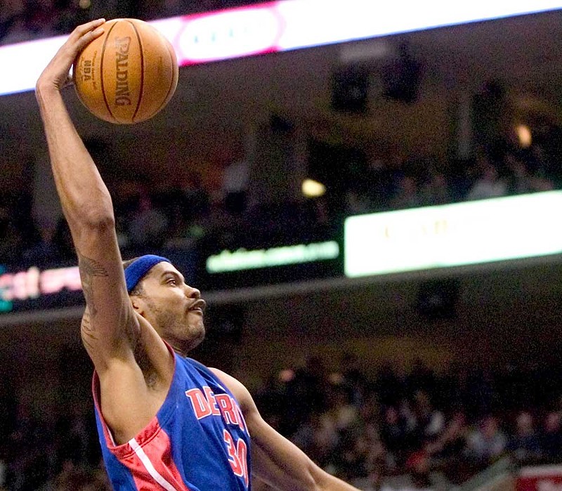 The Pistons’ Rasheed Wallace attacks the net in Philadelphia on Feb. 23, 2004. - UPI Photo/Jon Adams