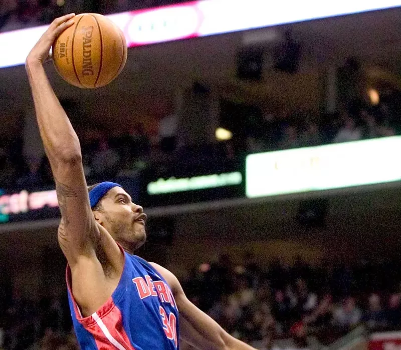 The Pistons’ Rasheed Wallace attacks the net in Philadelphia on Feb. 23, 2004. - UPI Photo/Jon Adams