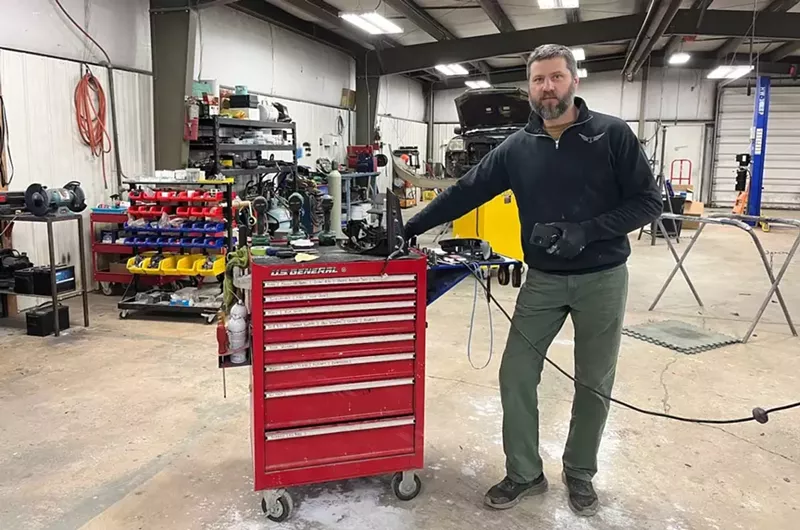 Vyacheslav Tsuber owns Tsuber Auto garage in Mesick, Michigan. He is thinking of heating his garage with natural gas to save money, but also said he has more homework to do to make a good environmental decision. - Izzy Ross / Grist