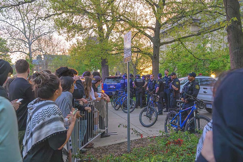 Police crack down on U-M student protesters in early May. - Doug Coombe