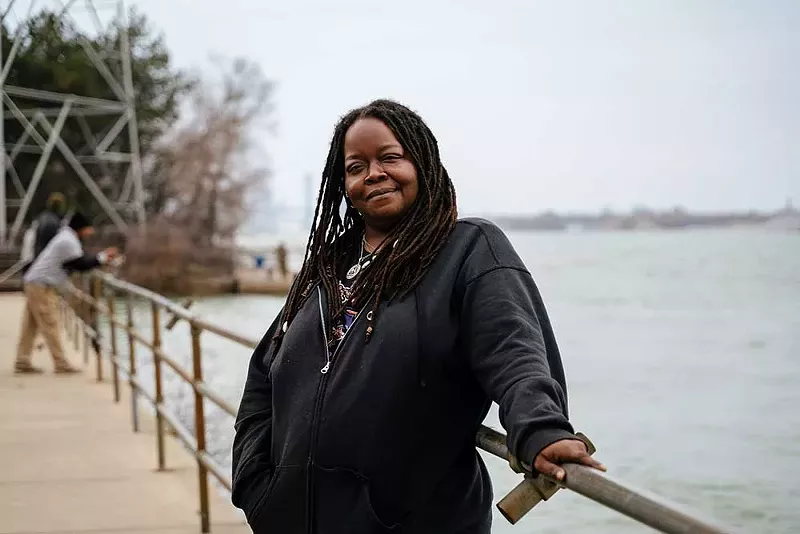 Tenitia Rudolf at the Detroit River at Delray Park, where she likes to fish. - Nick Hagen