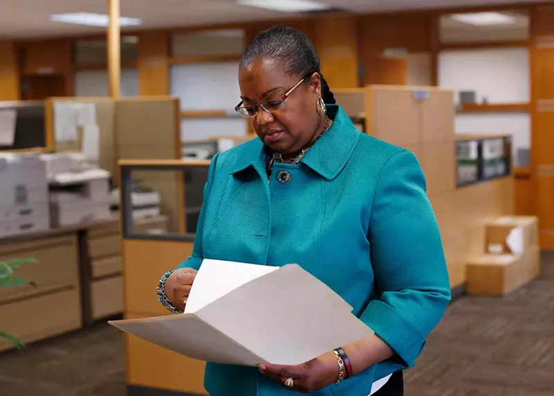 Wayne County Prosecutor Kym Worthy checks papers in Detroit Monday, April 20, 2015. - AP Photo/Paul Sancya