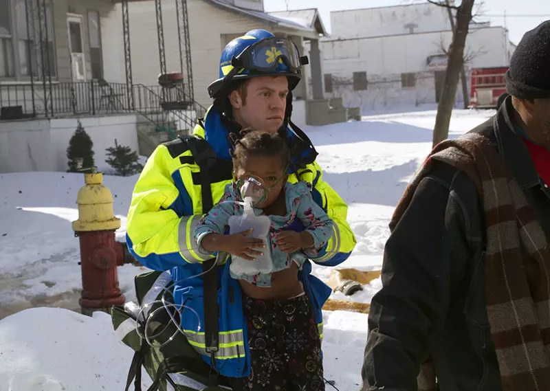 A Detroit medic rescued a child from a fire. - Steve Neavling