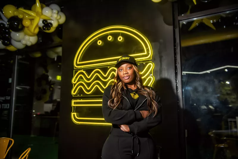 Instant smash: Matashia Dykes at her new Just Smash It burger restaurant on Eight Mile. - Kahn Santori Davison