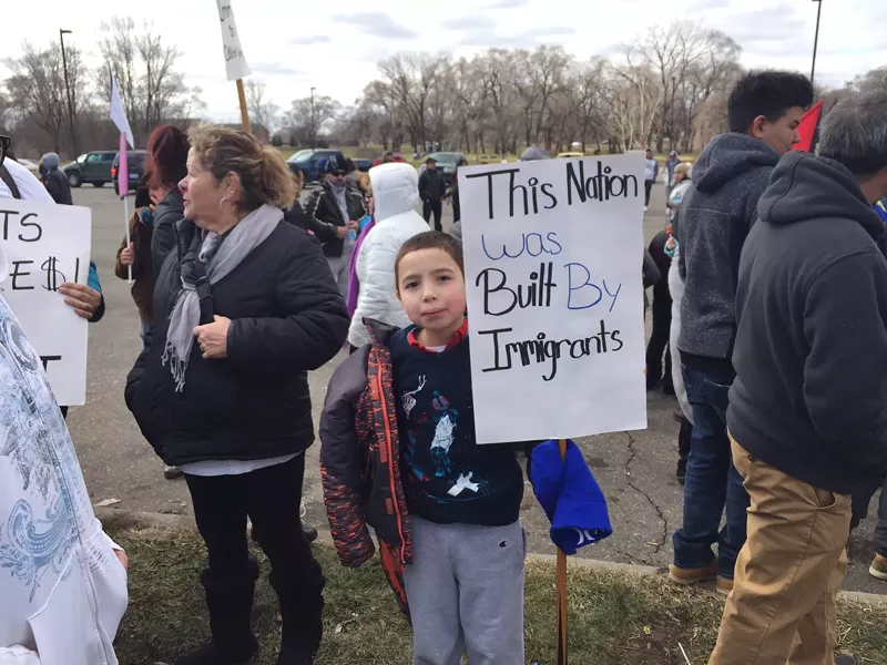 A little boy protests the Trump administration’s immigration agenda in southwest Detroit on “'A Day Without Immigrants.” - Violet Ikonomova