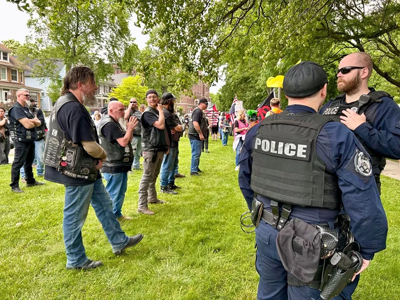 Detroit police initially stood near the bikers but eventually walked off. - Steve Neavling
