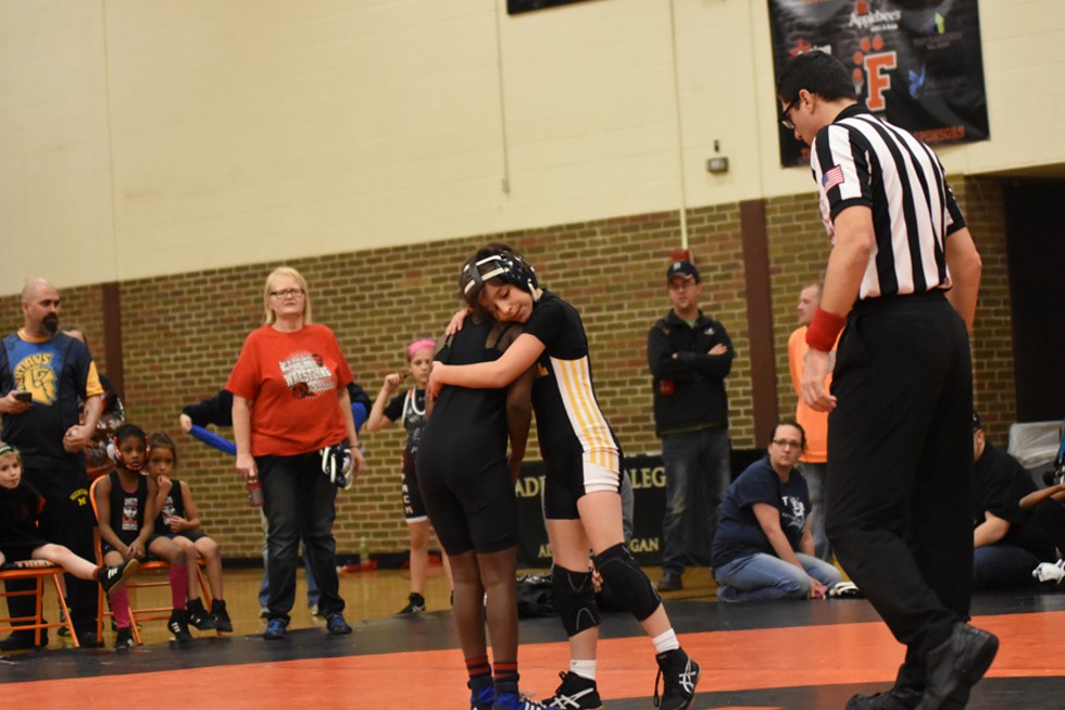 Female wrestlers don’t hold back during competition, but matches might end with a handshake­­ — or a hug. - Rachel Timlin