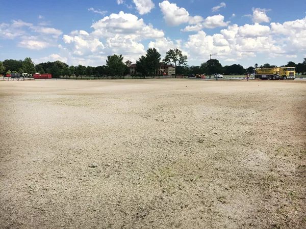 Large swaths of Belle Isle's grass - like this one between the Scott Fountain and Casino - were torn up by the Grand Prix. - Photo by Tom Perkins