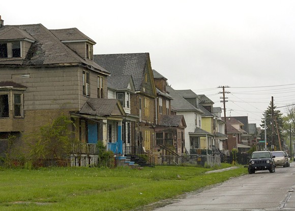 A row of dilapidated houses at Crane and Charlevoix on Detroit’s east side. Eleven houses on this block have been foreclosed since 2002. - Steve Neavling