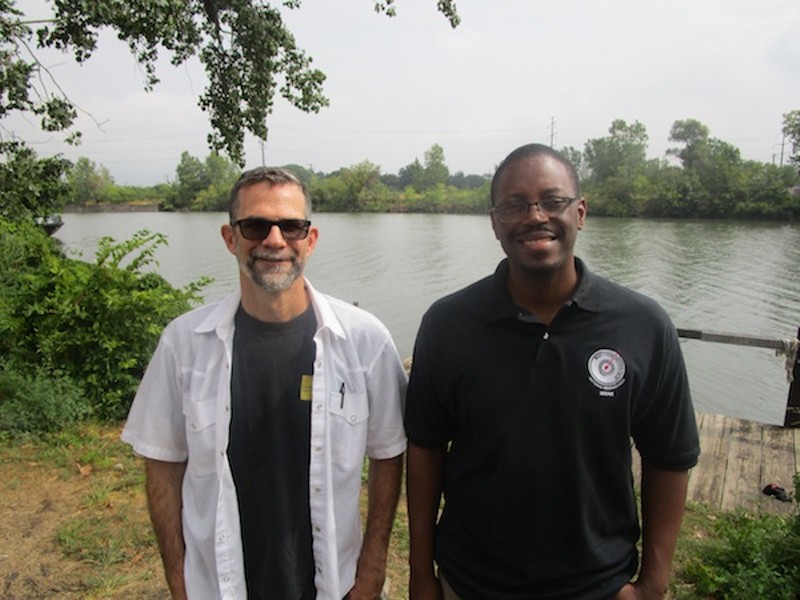 Paul Draus and Brian Yopp stand where they hope to see a park along the Rouge River. - Photo by Michael Jackman