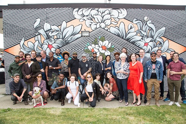 Some of Murals in the Markets' participating artists, photographed at a launch event at Eastern Market. - Courtesy photo
