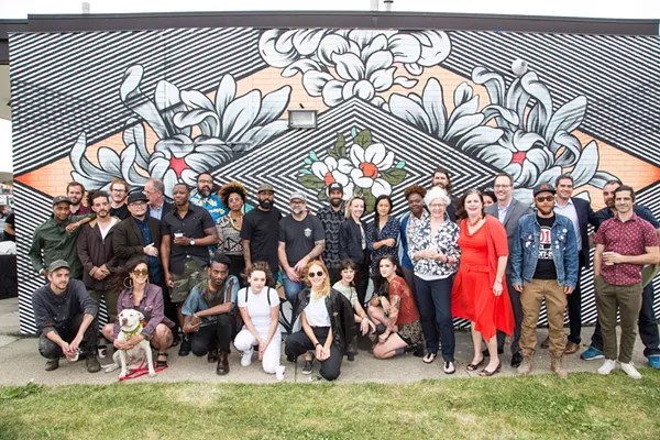 Some of Murals in the Markets' participating artists, photographed at a launch event at Eastern Market. - Courtesy photo