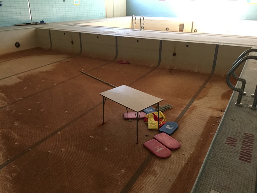 In this photo from the lawsuit, any water in the disused pools at Osborn High School is there only by accident. - PHOTO COURTESY PUBLIC COUNSEL