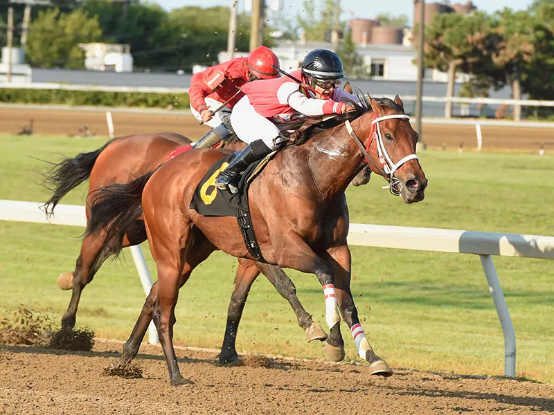 Melissa Zajac charges down the stretch aboard Rally With Class. - Rick DeLorme