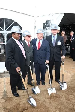 Detroit Mayor Mike Duggan poses with developers of the luxury DuCharme Place in Lafayette Park in 2015. - Courtesy of the City of Detroit