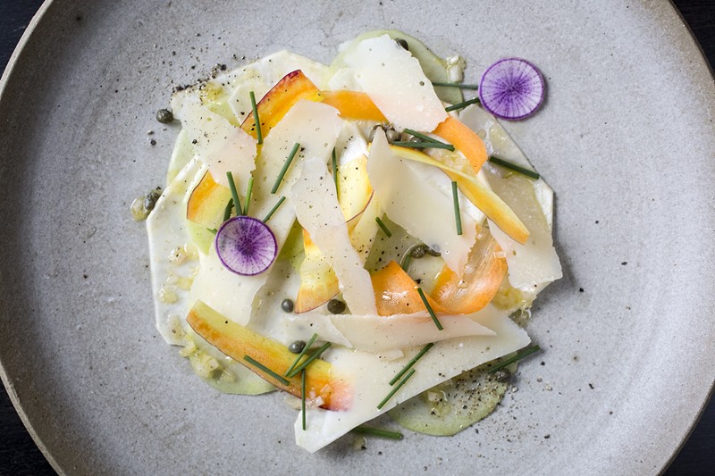 Selden Standard’s vegetable carpaccio: The dish’s painterly aspects are embodied in white daikon shavings trimmed with green, set off against curls of carrot and a couple paper-thin rounds of purple daikon. - Marvin Shaouni courtesy Selden Standard