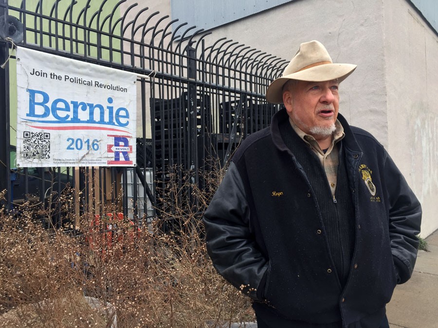 DSA elections committee co-chair Roger Robinson stands outside his building in Detroit's North End, which doubled as a campaign office for Bernie Sanders ahead of the 2016 presidential primary. - VIOLET IKONOMOVA