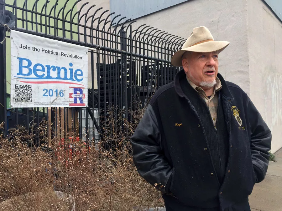 DSA elections committee co-chair Roger Robinson stands outside his building in Detroit's North End, which doubled as a campaign office for Bernie Sanders ahead of the 2016 presidential primary. - Violet Ikonomova