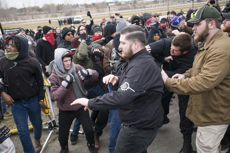 A neo-Nazi group and anti-fascist protesters clash. - TOM PERKINS