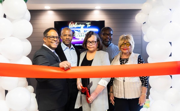 Detroit Deputy Mayor Todd Bettison, Dr. Louis Radden, Camille Hicks, City Council President Pro Tem James Tate and Police Commissioner Linda Bernard cutting at ribbon at Nuggets Dispensary.
