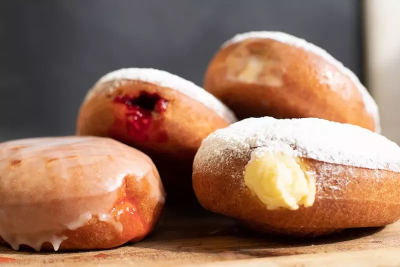 Crust — A Baking Company     104 W. Caroline St., Fenton; 810-629-8882; crustandbeyond.com     This artisanal bakery in Fenton uses real butter, eggs, and whole milk to make their house-made paczki that come in glazed and non-glazed varieties.