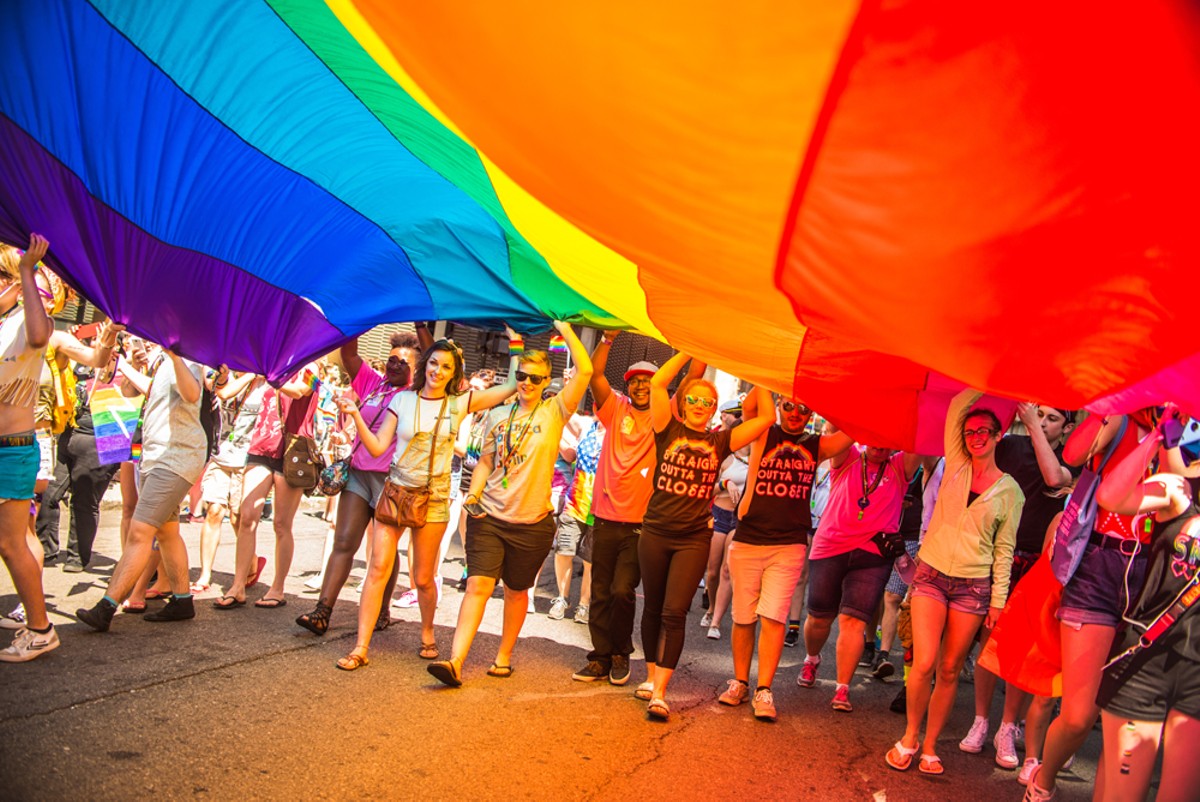 Festival goers will raise the rainbow flag during the Motor City Pride parade, June 8-9 in Hart Plaza.