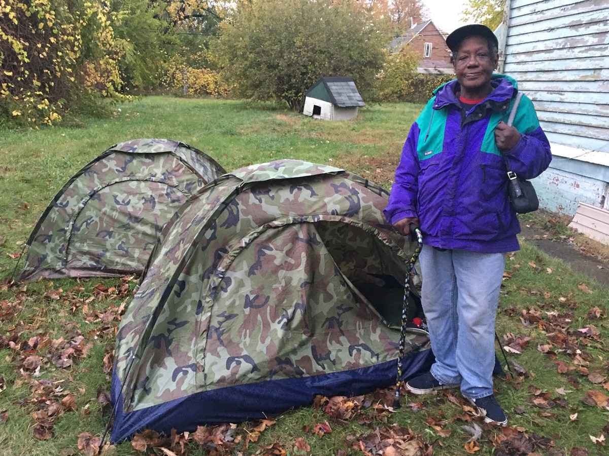 Sherry Barringer stands near her tent in Detroit’s only known homeless encampment, Resurrection City.