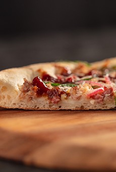 New York style pizza features a thin center crust with a crispy outer crust.