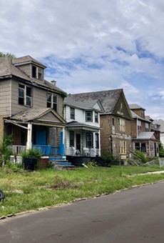 Row of occupied and abandoned homes on Detroit's east side.