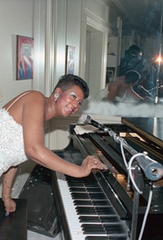 Aretha Franklin entertaining at her home during one of her Christmas parties.