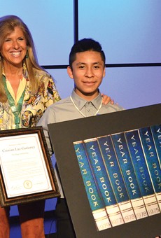Pictures of Hope founder Linda Solomon with 13-year-old Cesar Chavez Middle School student Cristian Luz-Gutierrez during a
reception Thursday at WXYZ.