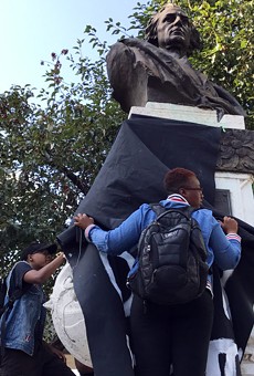 Protesters draped a black cloth over the Christopher Columbus statue in downtown Detroit in August 2017.