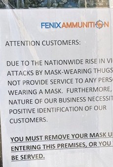 Novi ammo store's anti-mask sign was nothing more than 'a publicity stunt,' police say