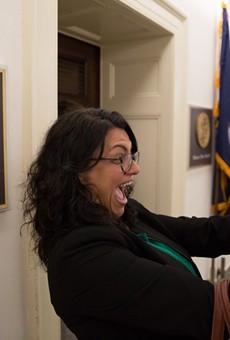 Rashida Tlaib snaps a selfie in front of her new office in 2019.