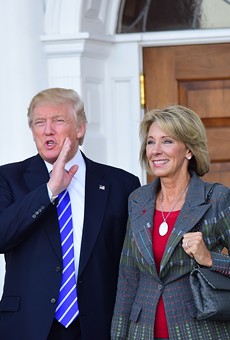 Then President-elect Donald Trump meets with Betsy DeVos at Trump International in Bedminister, New Jersey on Nov. 19, 2016.
