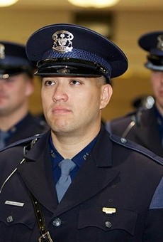 Bessner, among a sea of other white officers, during his Michigan State Trooper graduation in 2012.
