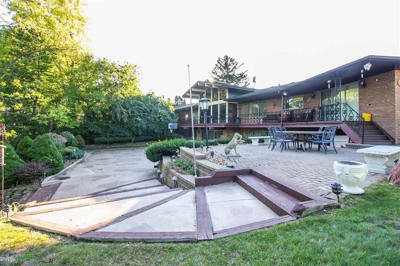 This retro $597k home in Clinton Township has a mirrored indoor koi pond &#151;&nbsp;and we are speechless